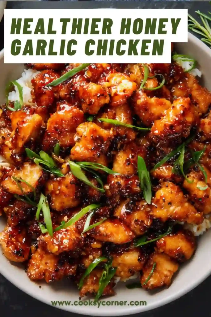 Healthy skillet honey garlic chicken garnished with sliced green onions.
