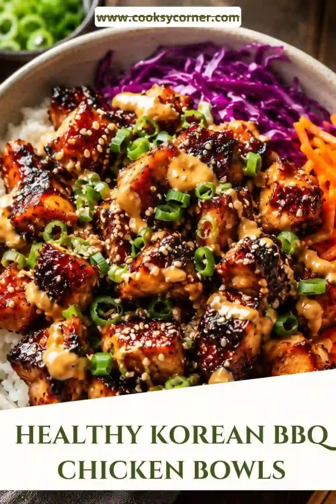 A colorful Korean BBQ Chicken Bowl topped with gochujang-glazed chicken, rice, cucumber, carrots, edamame, kimchi, sesame seeds, and green onions.