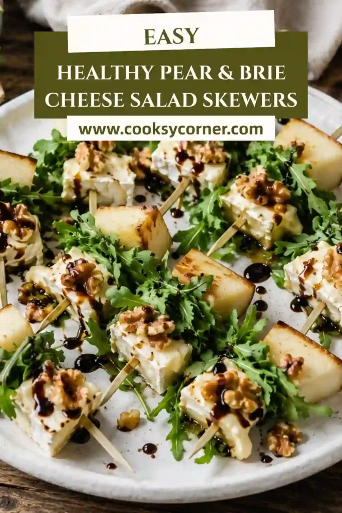 Fresh pear appetizer skewers featuring brie cheese, walnuts, and arugula. A healthy and elegant finger food ideal for holidays and celebrations.