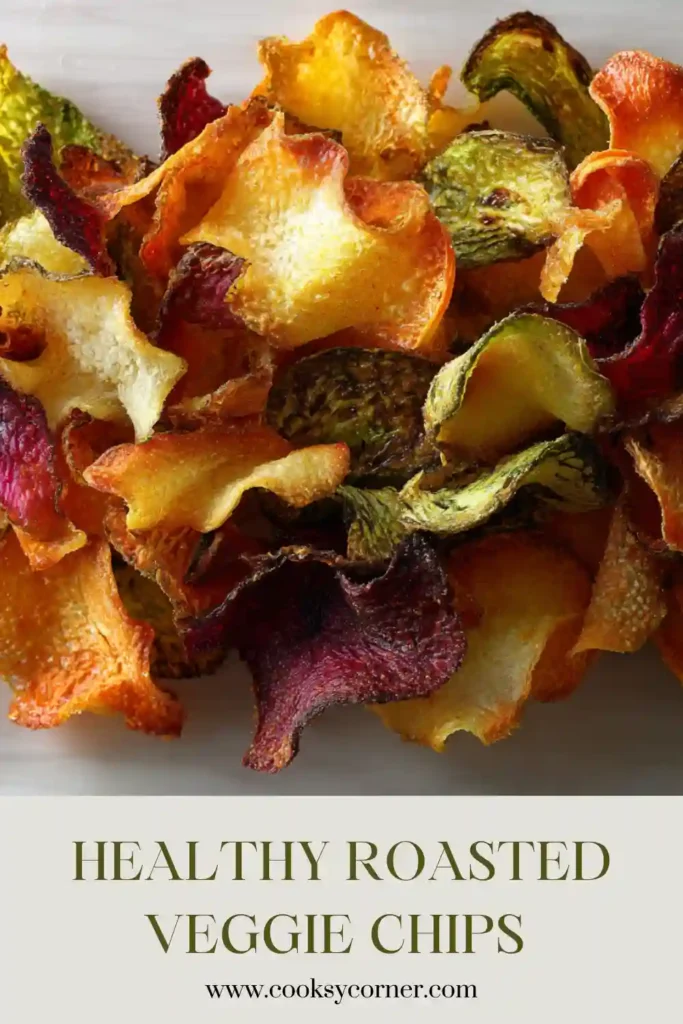 A colorful tray of Roasted Veggie Chips made from beets, parsnips, turnips, and radishes. These crispy homemade vegetable chips are seasoned with fresh herbs and roasted until golden.