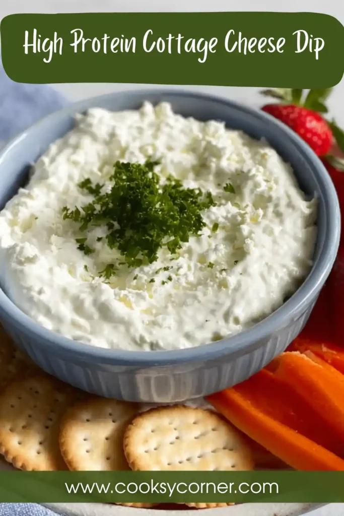 A bowl of creamy High Protein Cottage Cheese Dip topped with fresh chives. This healthy cottage cheese dip is served with crisp vegetables for a nutritious snack.