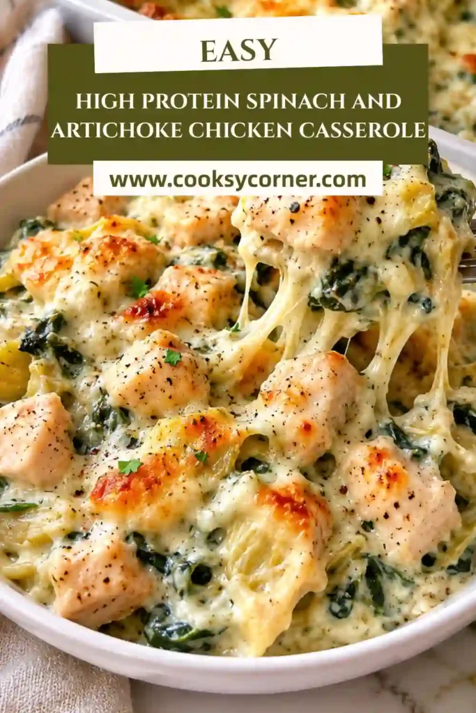 A serving of High Protein Spinach and Artichoke Chicken Casserole on a white plate. The creamy chicken dish features spinach, artichokes, and melted cheese.