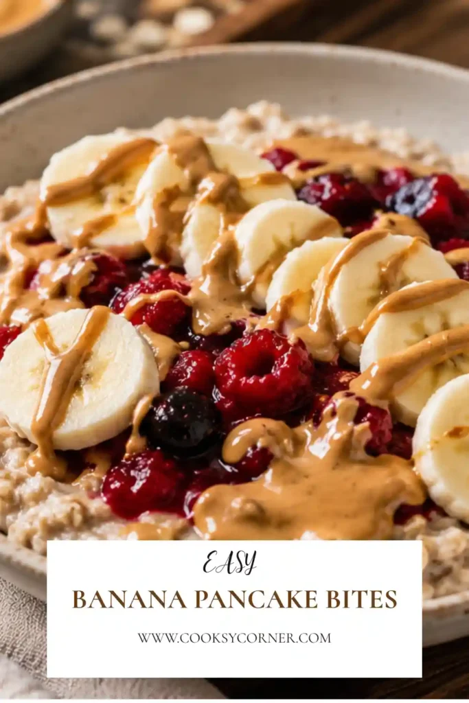 High Protein Vegan Oatmeal served in a ceramic bowl with colorful berries and sliced bananas.