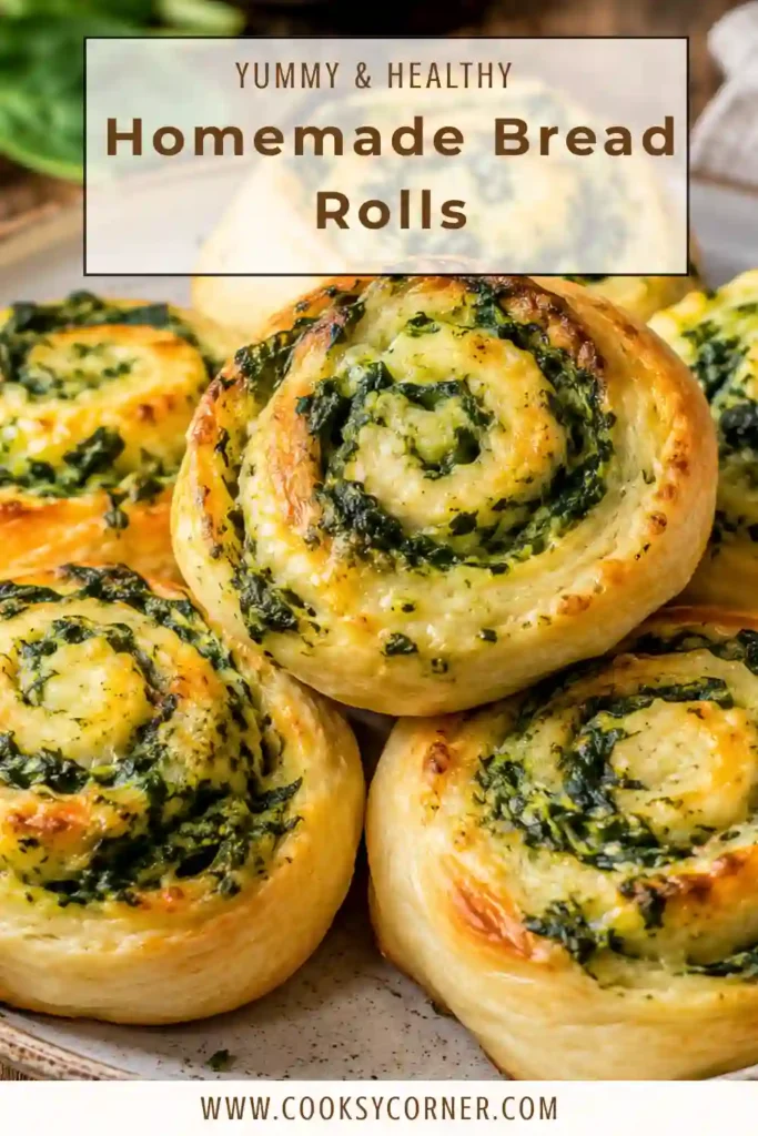 Golden Homemade Bread Rolls filled with spinach and mozzarella cheese arranged on a serving plate. The rolls have a soft interior and a shiny butter-brushed crust.