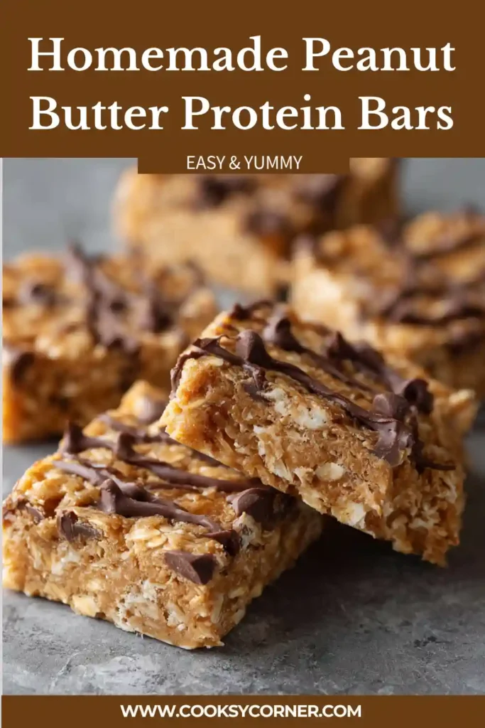 Stacked peanut butter protein bars displayed on a serving board with oats and peanut butter nearby.