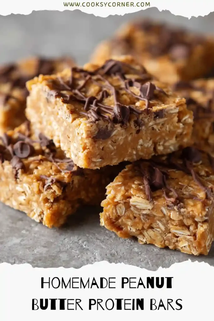 Homemade Peanut Butter Protein Bars topped with mini chocolate chips and flaky sea salt.