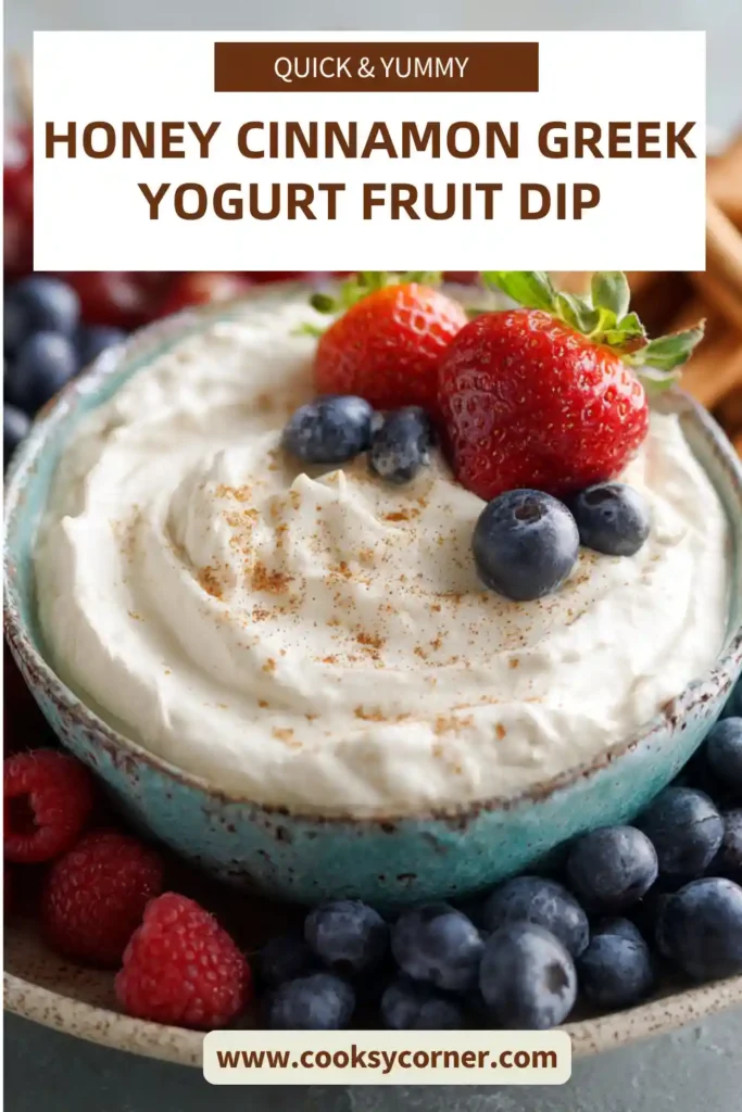 Bowl of honey yogurt dip with strawberries, grapes, and banana slices for dipping.