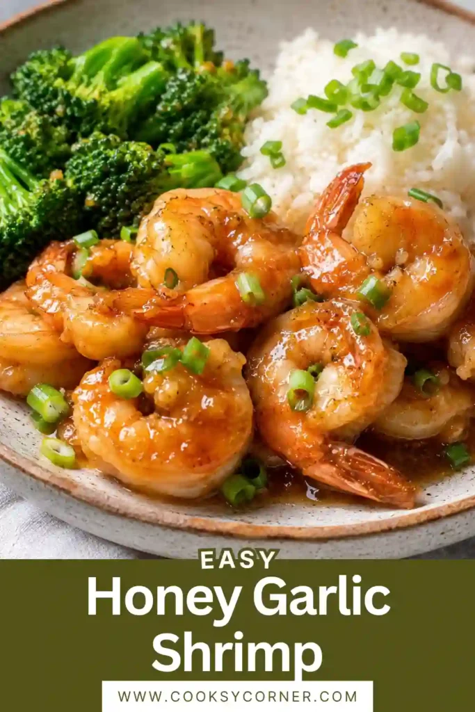Freshly cooked honey garlic shrimp in a skillet surrounded by glossy sauce and chopped green onions. A simple and healthy shrimp meal.