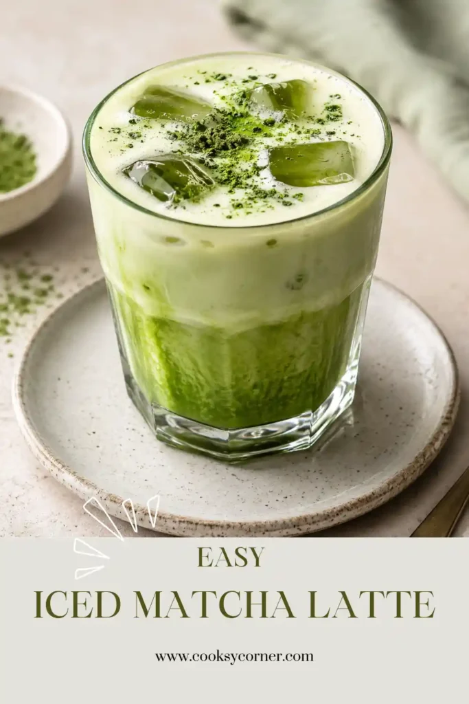 Homemade Iced Matcha Latte served in a glass with ice cubes and creamy almond milk layered beneath vibrant green matcha.