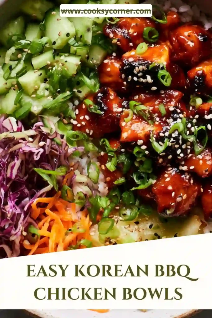 A bowl of Korean BBQ Chicken Bowls topped with caramelized gochujang chicken, fluffy white rice, cucumber, carrots, and sesame seeds. The colorful ingredients create a vibrant and satisfying Korean-inspired meal.