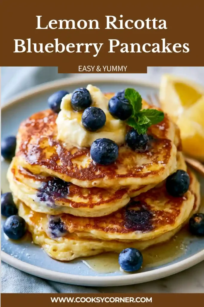 A stack of Lemon Ricotta Blueberry Pancakes topped with whipped honey butter and maple syrup. Fresh blueberries and lemon zest add bright flavor and color.