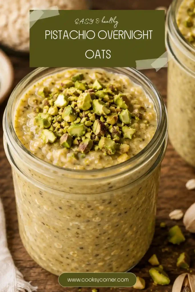 A jar of Pistachio Overnight Oats topped with chopped pistachios and a drizzle of pistachio butter. This high-protein breakfast features creamy oats soaked overnight for a rich and satisfying texture.