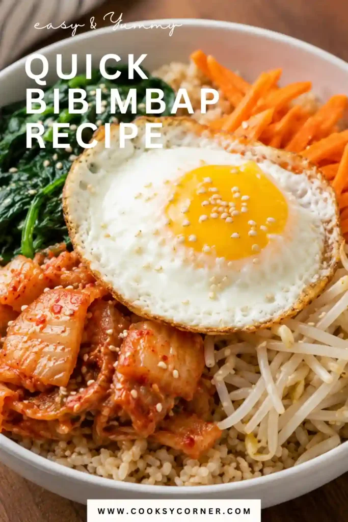 Easy Quick Bibimbap Recipe topped with spinach, bean sprouts, shredded carrots, chopped kimchi, toasted sesame seeds, and a golden fried egg over fluffy jasmine rice.