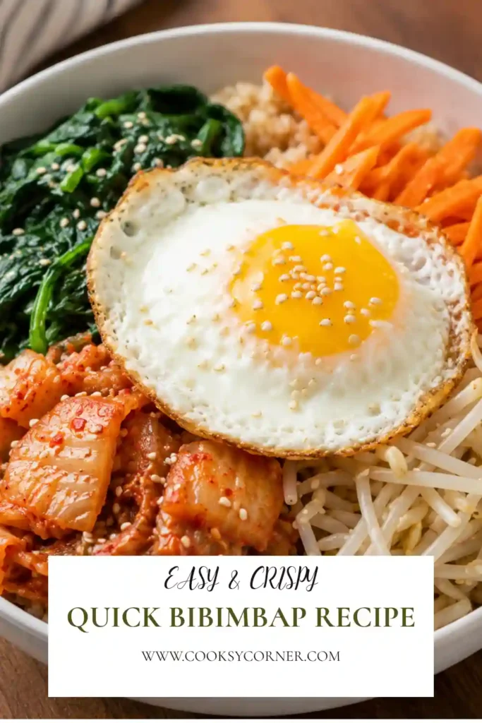 Homemade Quick Bibimbap featuring crispy jasmine rice, sautéed spinach, bean sprouts, carrots, kimchi, sesame seeds, and a sunny-side-up egg in a beautiful serving bowl.