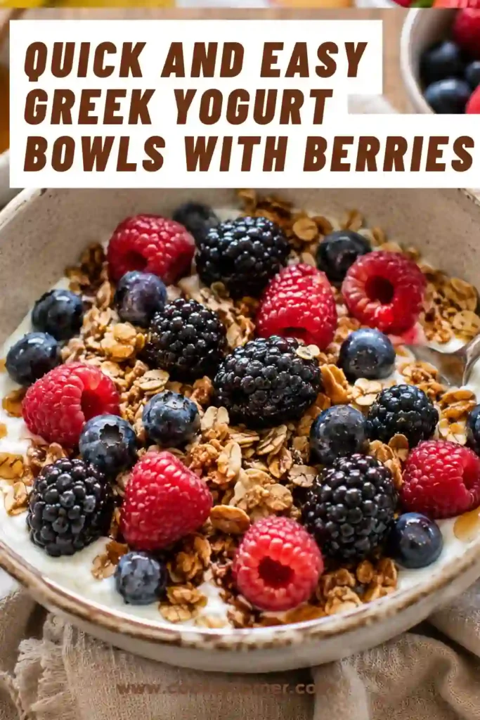 A bowl of creamy Greek yogurt topped with fresh blueberries, raspberries, blackberries, crunchy granola, and a drizzle of honey.