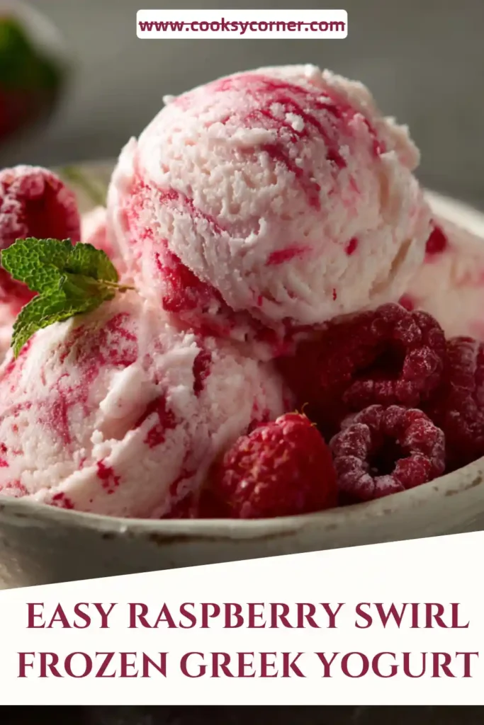 A bowl of Raspberry Swirl Frozen Greek Yogurt topped with fresh raspberries. The creamy frozen yogurt features vibrant raspberry ribbons throughout for a refreshing summer dessert.