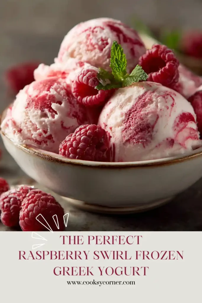 Close-up of homemade Raspberry Swirl Frozen Greek Yogurt served in a glass dessert bowl. Fresh raspberries garnish the creamy frozen yogurt for an elegant presentation.