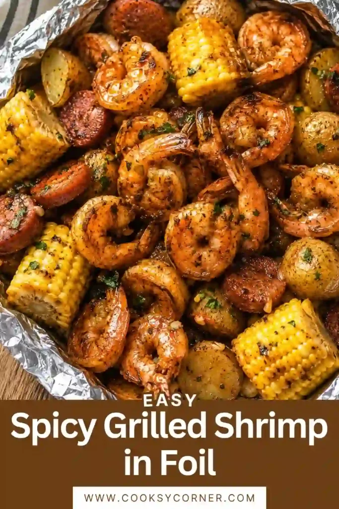 Close-up of shrimp foil packets featuring tender seafood, sweet corn, potatoes, and seasoned beef sausage. A flavorful seafood boil-inspired meal perfect for grilling season.