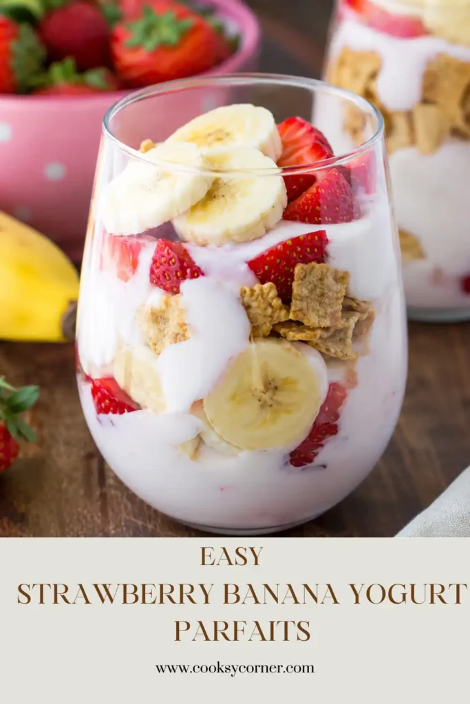 Homemade Strawberry Banana Yogurt Parfaits served in parfait glasses with fresh fruit and granola.