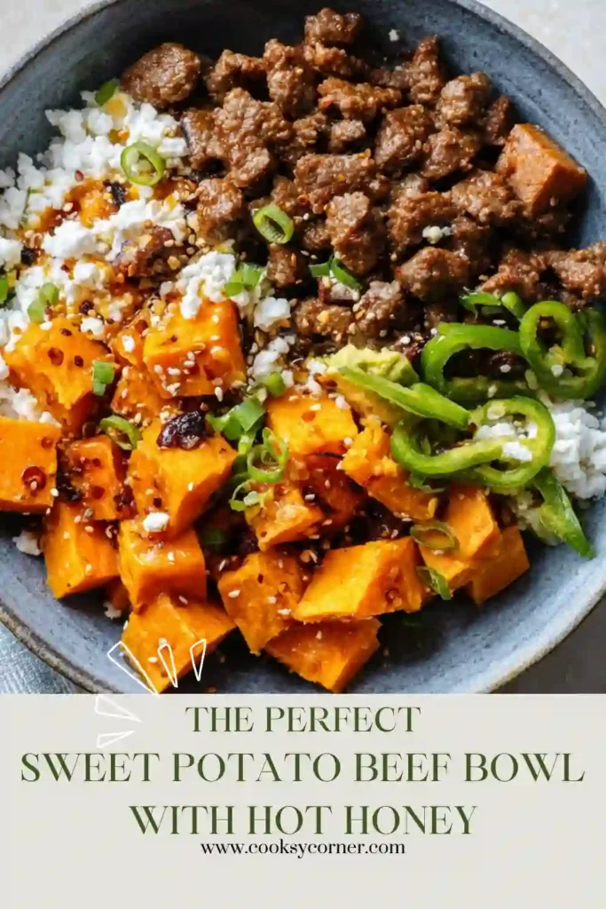 A high-protein Sweet Potato Beef Bowl topped with creamy cottage cheese, ripe avocado, black beans, and shredded cheddar cheese. Hot honey adds the perfect finishing touch.
