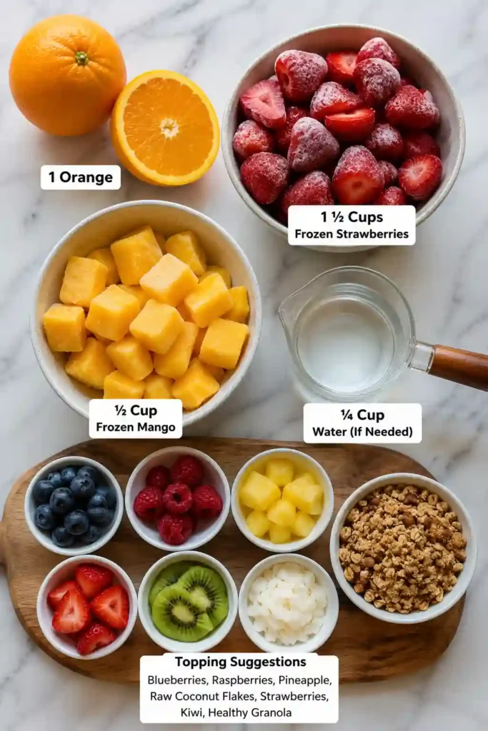 Bright and creamy Tropical Smoothie Bowl served with kiwi slices, coconut flakes, berries, and granola. A refreshing fruit smoothie bowl for breakfast.