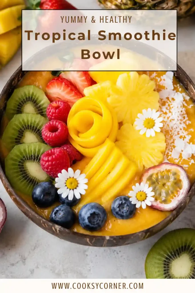 Fresh Tropical Smoothie Bowl featuring mango, strawberries, orange, and colorful fruit toppings. Perfect for a nutritious and easy morning meal.