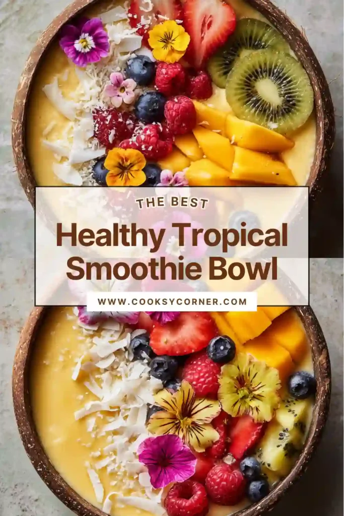 Tropical Smoothie Bowl topped with strawberries, blueberries, kiwi, coconut flakes, and granola in a white bowl.