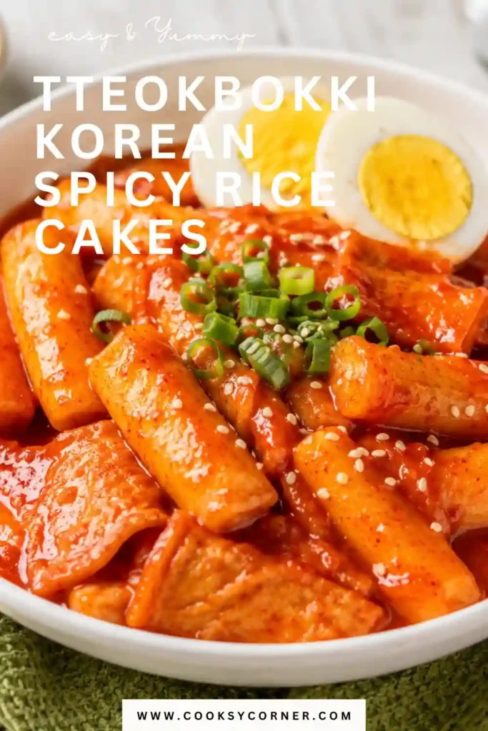 Homemade Korean spicy rice cakes served with scallions, sesame seeds, and hard-boiled eggs.