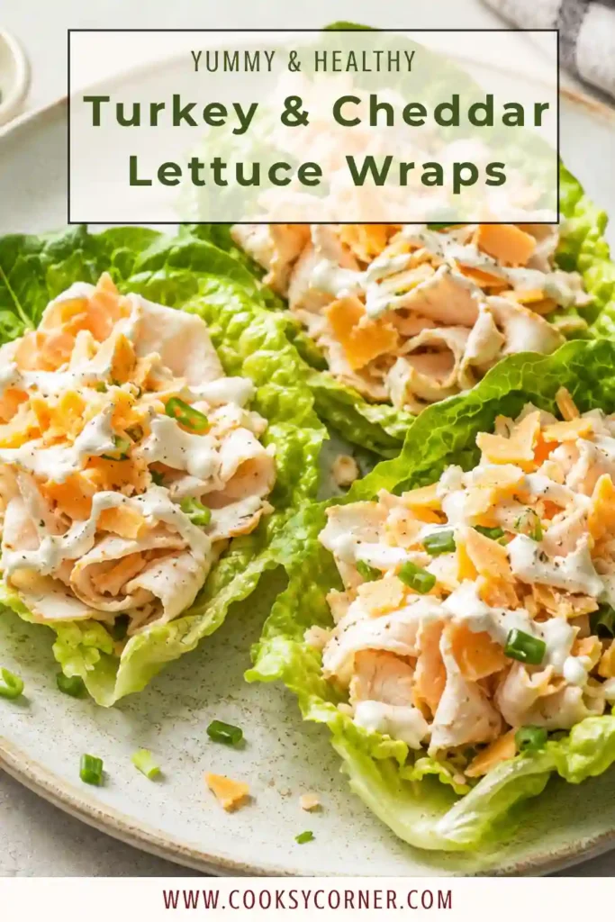 A close-up view of homemade Turkey & Cheddar Lettuce Wraps with creamy pickle mustard spread. The protein-packed wraps make an ideal healthy lunch or meal-prep recipe.