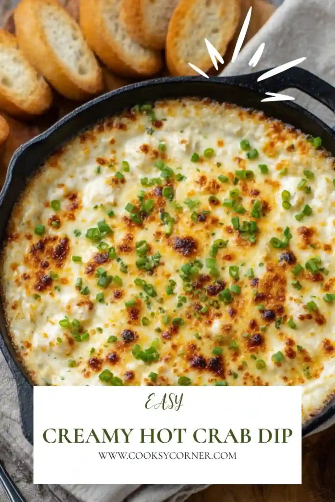 Close-up of creamy baked crab dip topped with green onions and melted cheese. This easy keto crab dip is rich, cheesy, and full of seafood flavor.