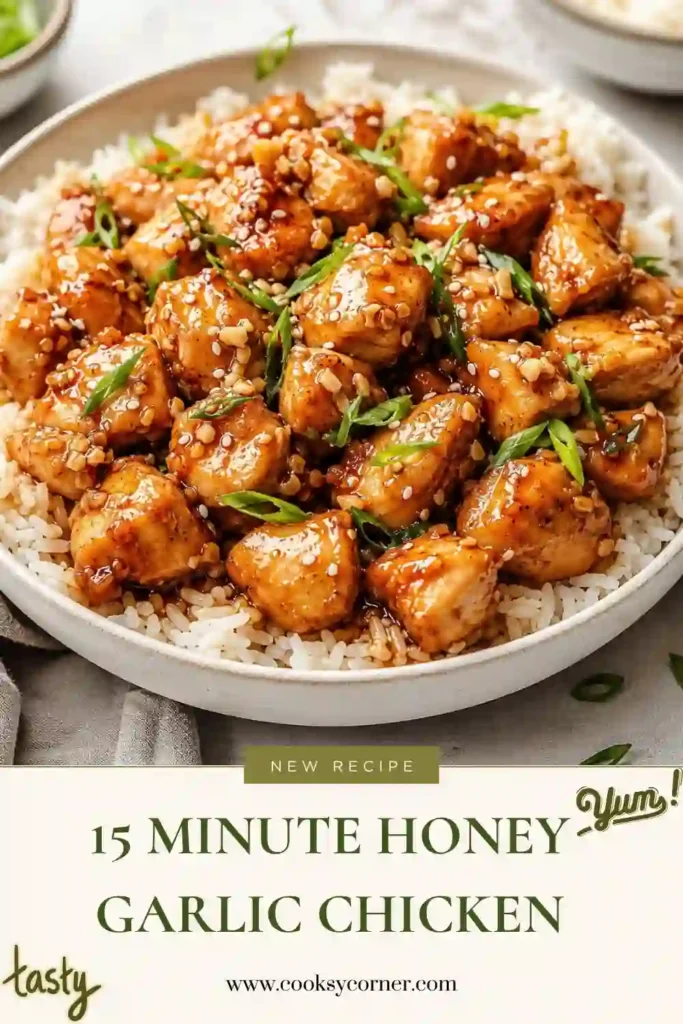 A bowl of Honey Garlic Chicken served over steamed white rice with green onions and sesame seeds. The chicken is coated in a glossy honey garlic sauce that's perfect for a quick weeknight dinner.
