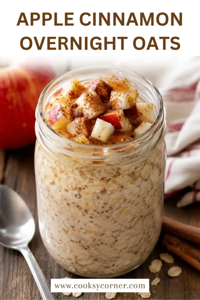 A mason jar filled with Apple Cinnamon Overnight Oats topped with fresh diced apples, raisins, chopped walnuts, and a sprinkle of cinnamon. This healthy overnight oats recipe is ideal for meal prep breakfasts.