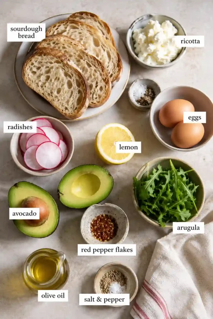 Healthy avocado toast featuring creamy ricotta, fresh vegetables, and poached eggs served on crispy artisan toast. A simple brunch recipe that's both nutritious and flavorful.