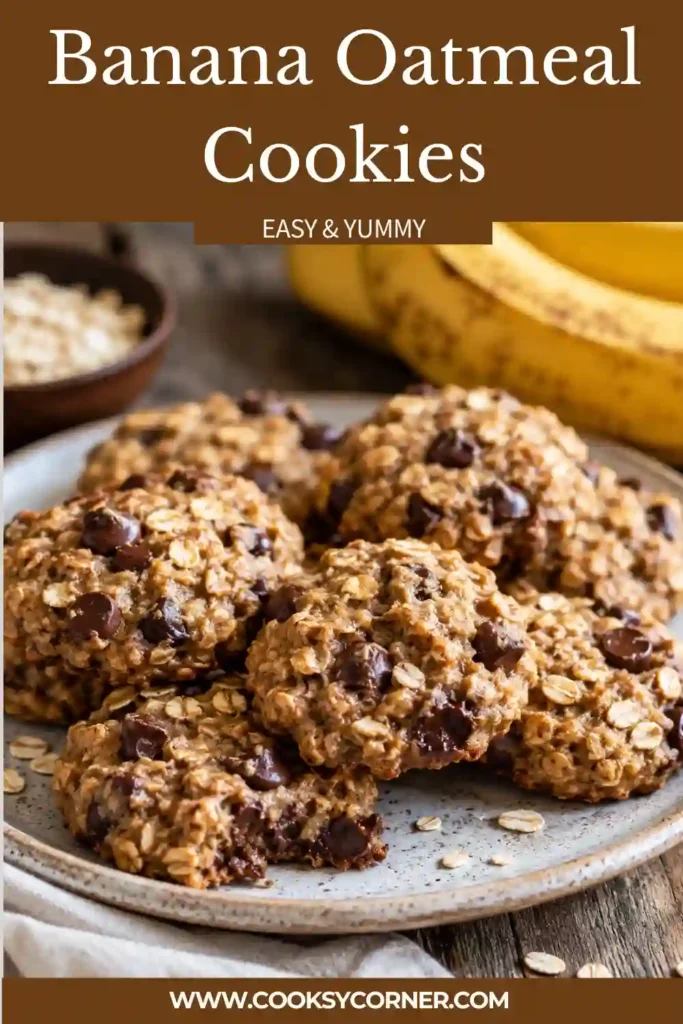 Close-up of Banana Oatmeal Cookies showing chewy oats, ripe banana, and chocolate chips throughout each cookie. The cookies are lightly golden and freshly baked.