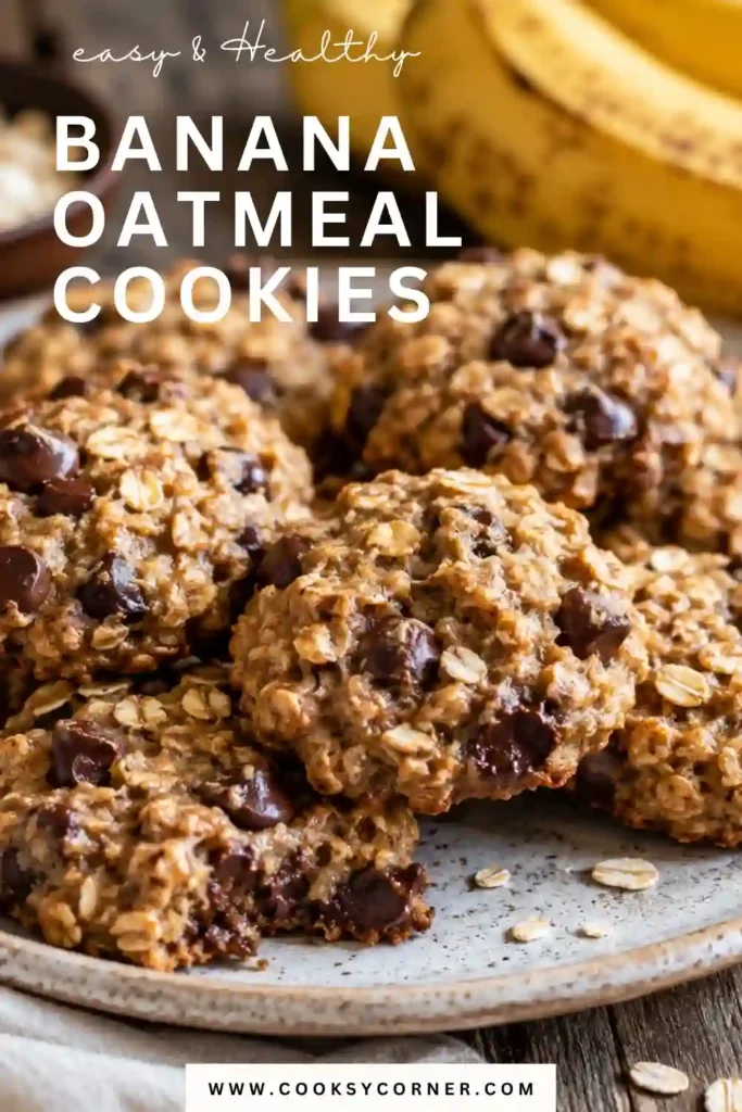 A plate of Banana Oatmeal Cookies filled with ripe bananas, oats, and chocolate chips. The cookies have golden edges, a soft center, and are stacked on a rustic plate.