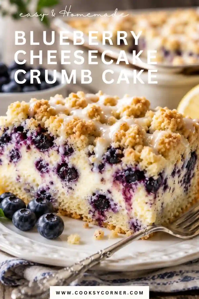 A slice of Blueberry Cheesecake Crumb Cake with creamy cheesecake filling, fresh blueberries, and a golden buttery crumb topping on a dessert plate. Perfect for brunch, coffee breaks, or special occasions.