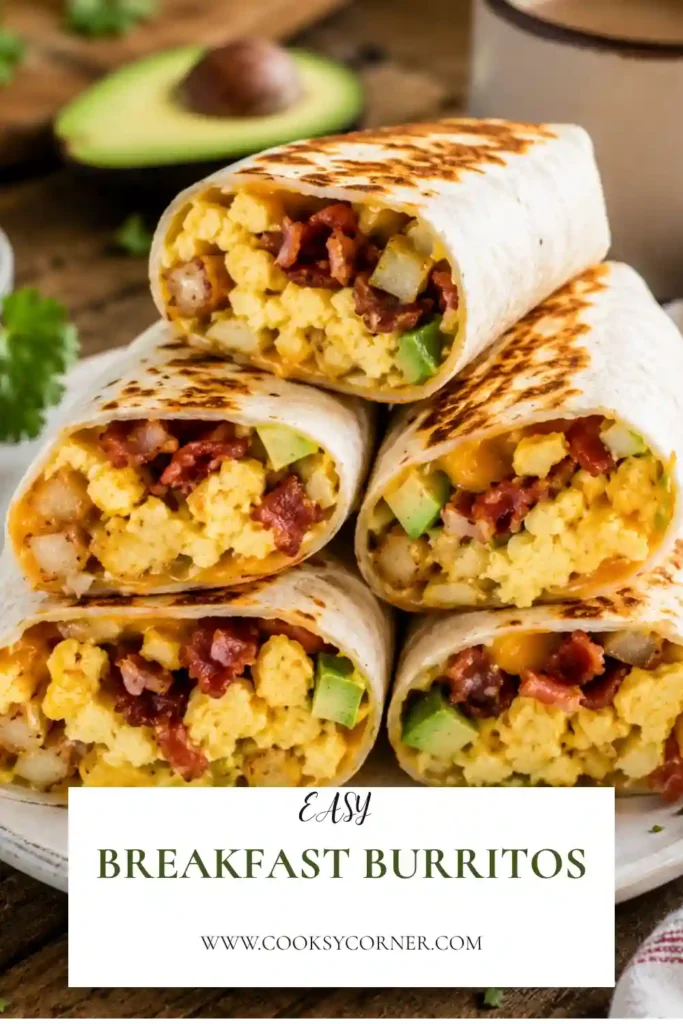 Freshly toasted Breakfast Burritos filled with scrambled eggs, crispy hash browns, turkey ham, melted cheese, avocado, and salsa. The burritos are sliced in half to reveal their flavorful filling.