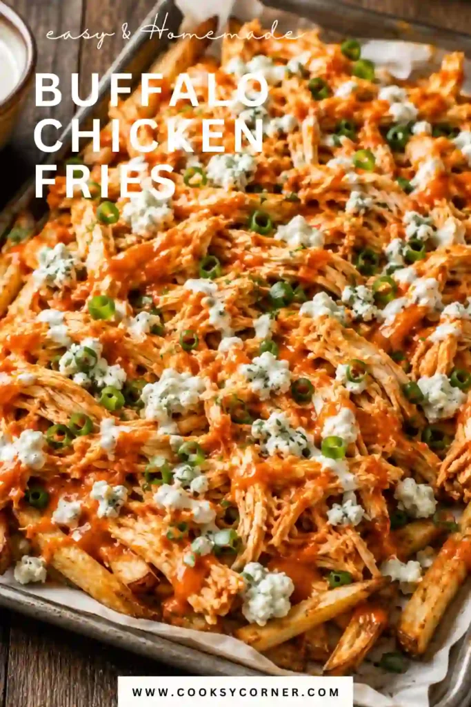 Buffalo Chicken Fries served on a platter with crispy oven baked fries, shredded buffalo chicken, blue cheese crumbles, and creamy blue cheese dressing. Fresh green onions add a colorful finishing touch.
