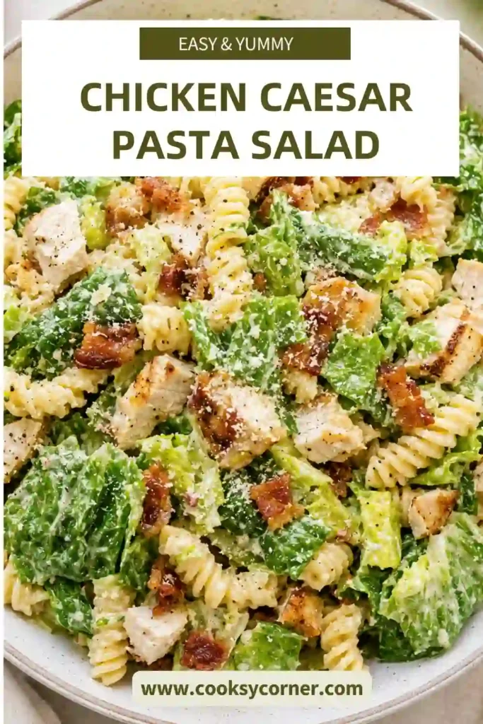 Creamy Chicken Caesar Pasta Salad served in a large bowl with grilled chicken, pasta, crisp lettuce, Parmesan cheese, and turkey ham. Ideal for meal prep and summer gatherings.