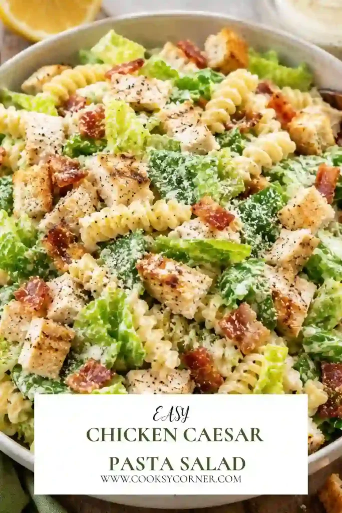 Fresh Chicken Caesar Pasta Salad featuring tender grilled chicken, rotini pasta, crunchy romaine lettuce, shredded Parmesan, turkey ham, and creamy Caesar dressing. A delicious family-friendly meal.