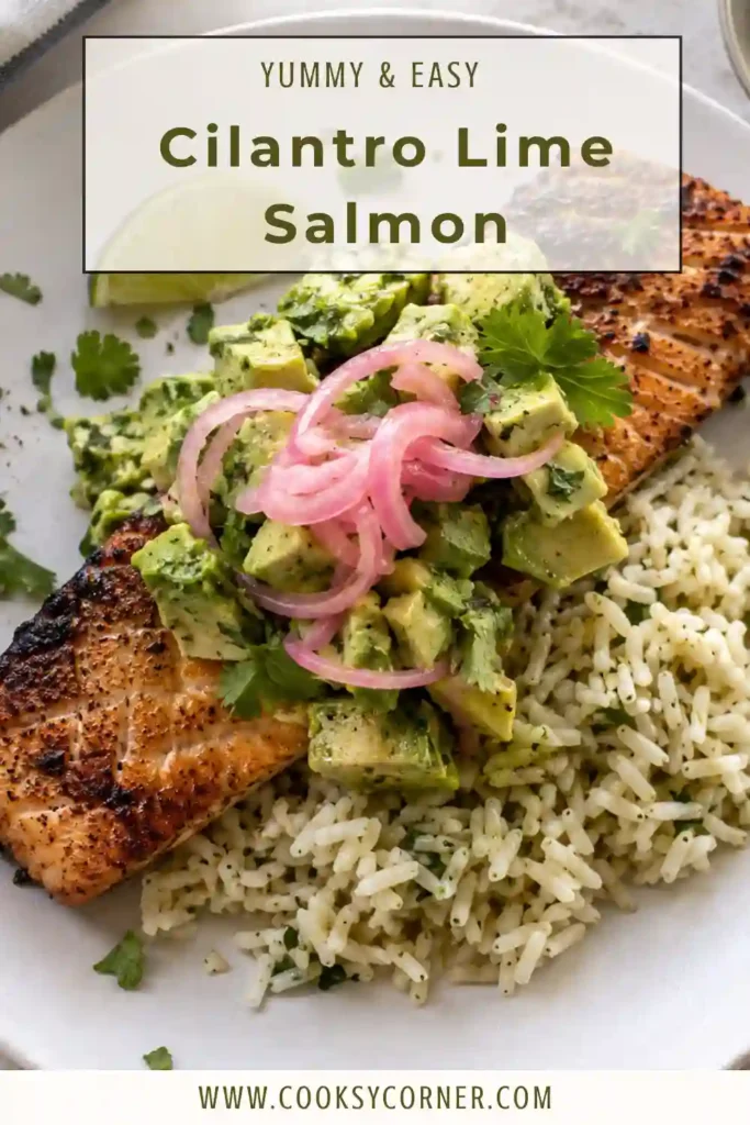 Healthy baked salmon with cilantro, garlic, lime, and fresh tomatoes served on a platter.