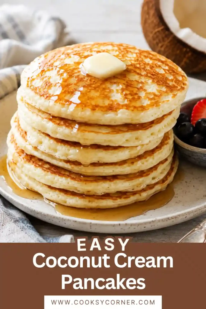 Freshly cooked Coconut Cream Pancakes garnished with shredded coconut and butter. These breakfast pancakes are light, tender, and perfect for weekend brunch.