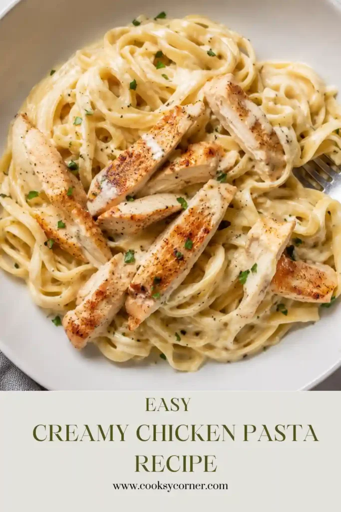 1. A bowl of creamy chicken pasta topped with sliced chicken breast, freshly grated Parmesan, rosemary, and lemon zest. The rich cream sauce coats every piece of pasta beautifully.