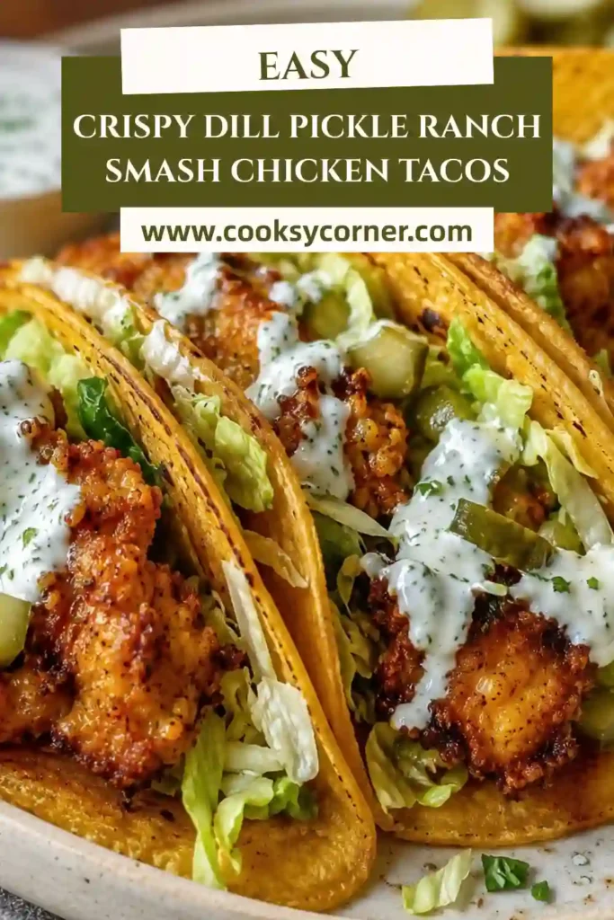Close-up of crispy ground chicken tacos layered with ranch dressing, cheddar cheese, lettuce, and dill pickle slices on warm corn tortillas. A delicious easy taco recipe.
