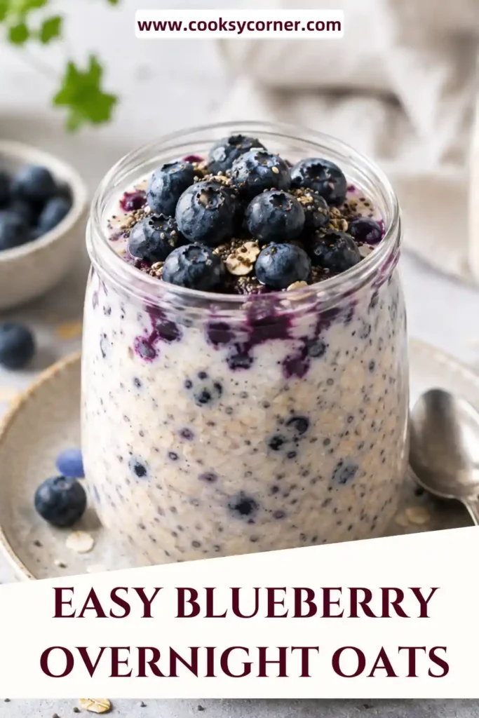 A glass jar filled with creamy Blueberry Overnight Oats topped with fresh blueberries and Greek yogurt. This healthy make-ahead breakfast is perfect for busy mornings and meal prep.