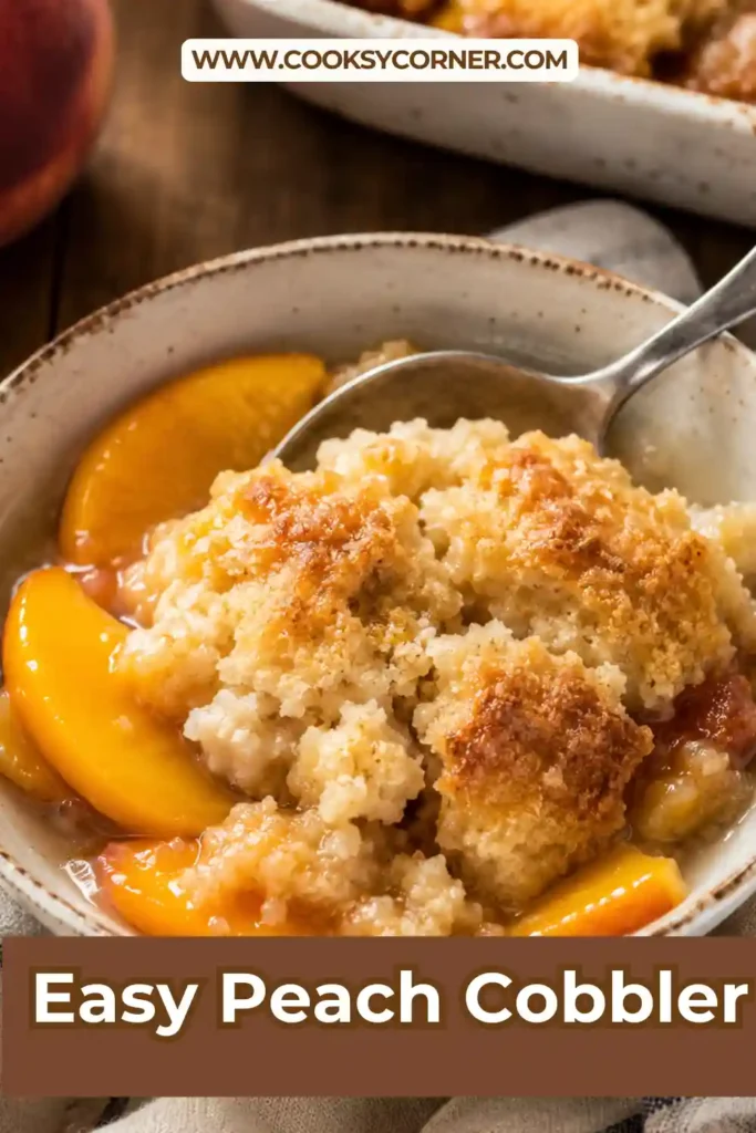 A warm Peach Cobbler baked with juicy fresh peaches and a golden buttery crust, served with a scoop of vanilla ice cream.
