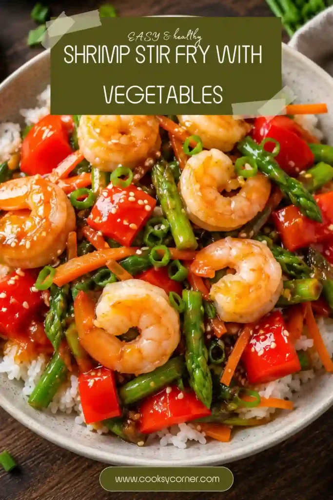 Healthy shrimp and vegetable stir fry made in a skillet with fresh vegetables and flavorful homemade sauce. Served hot with steamed rice.