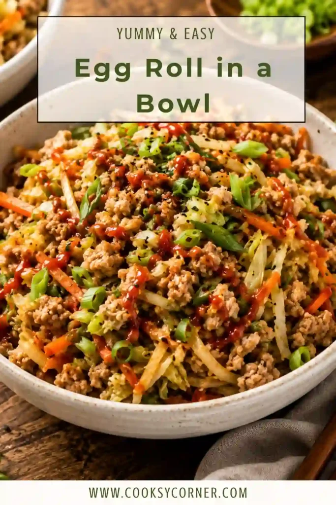 A bowl of Egg Roll in a Bowl made with ground chicken, broccoli slaw, green onions, sesame seeds, and fresh cilantro. This healthy low-carb meal is colorful, flavorful, and perfect for weeknight dinners.
