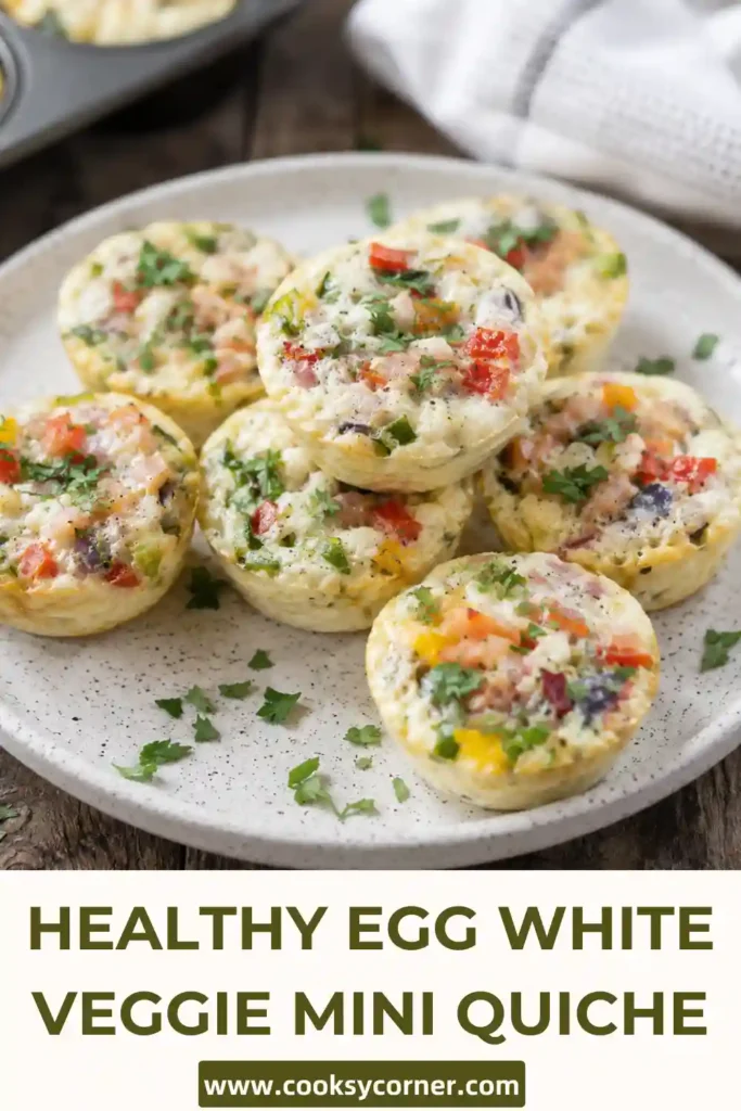 Homemade Egg White Veggie Mini Quiche served on a breakfast plate with fresh herbs. These crustless egg muffins are healthy, colorful, and family-friendly.