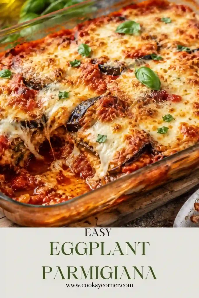 Close-up of baked Eggplant Parmigiana featuring bubbling mozzarella, Parmesan, roasted eggplant slices, and fresh basil. Perfect for a hearty meatless meal.